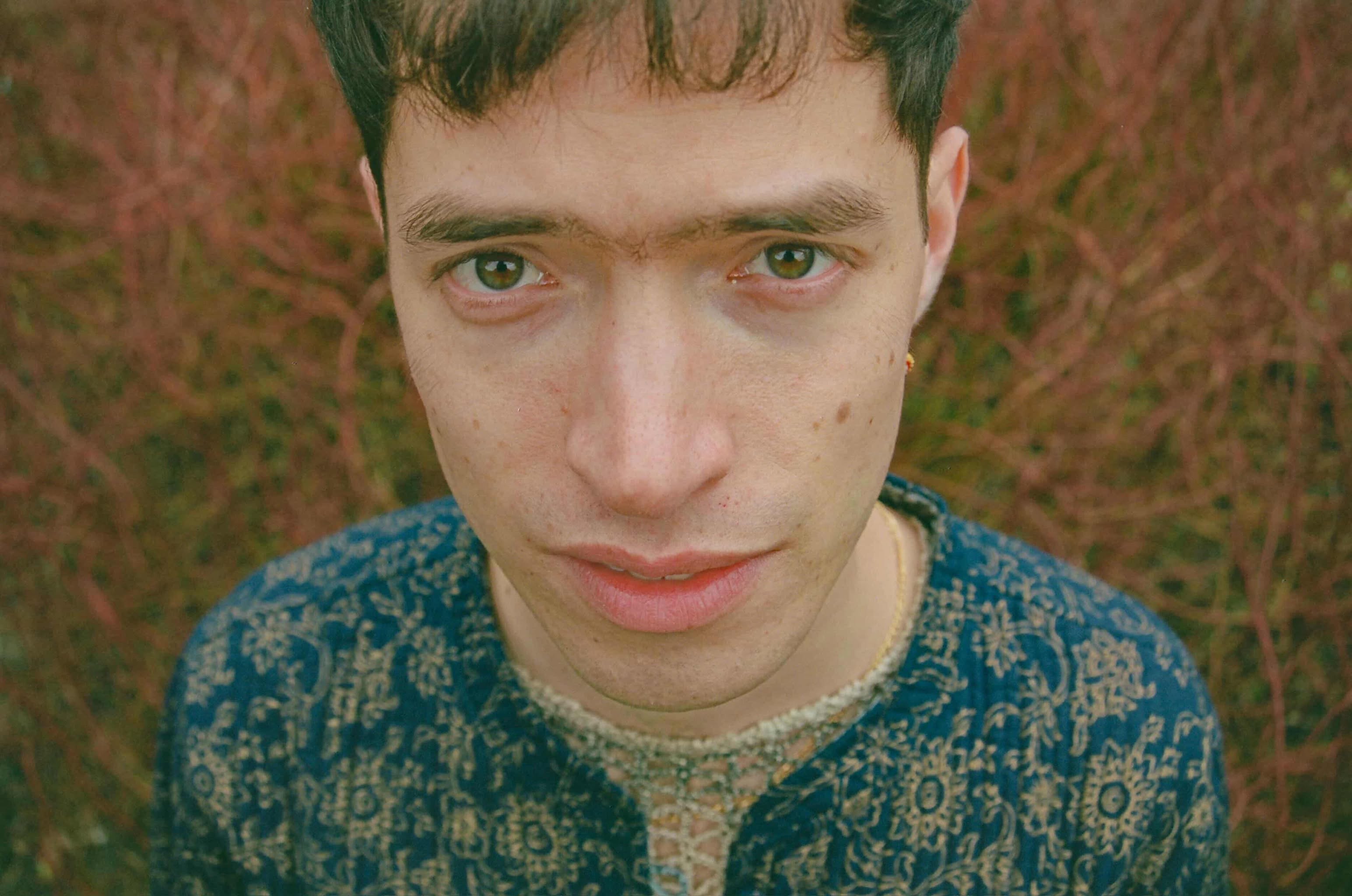 Eli Carvajal looking at the camera on the intimate picture on the field.